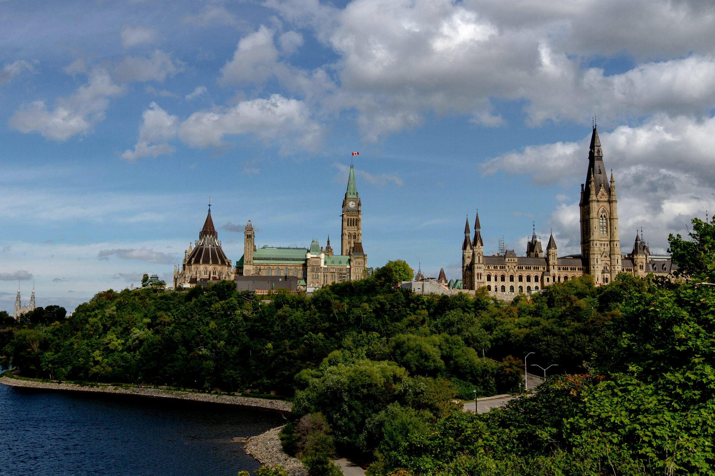Parliament Hill Ottawa above the river and trees