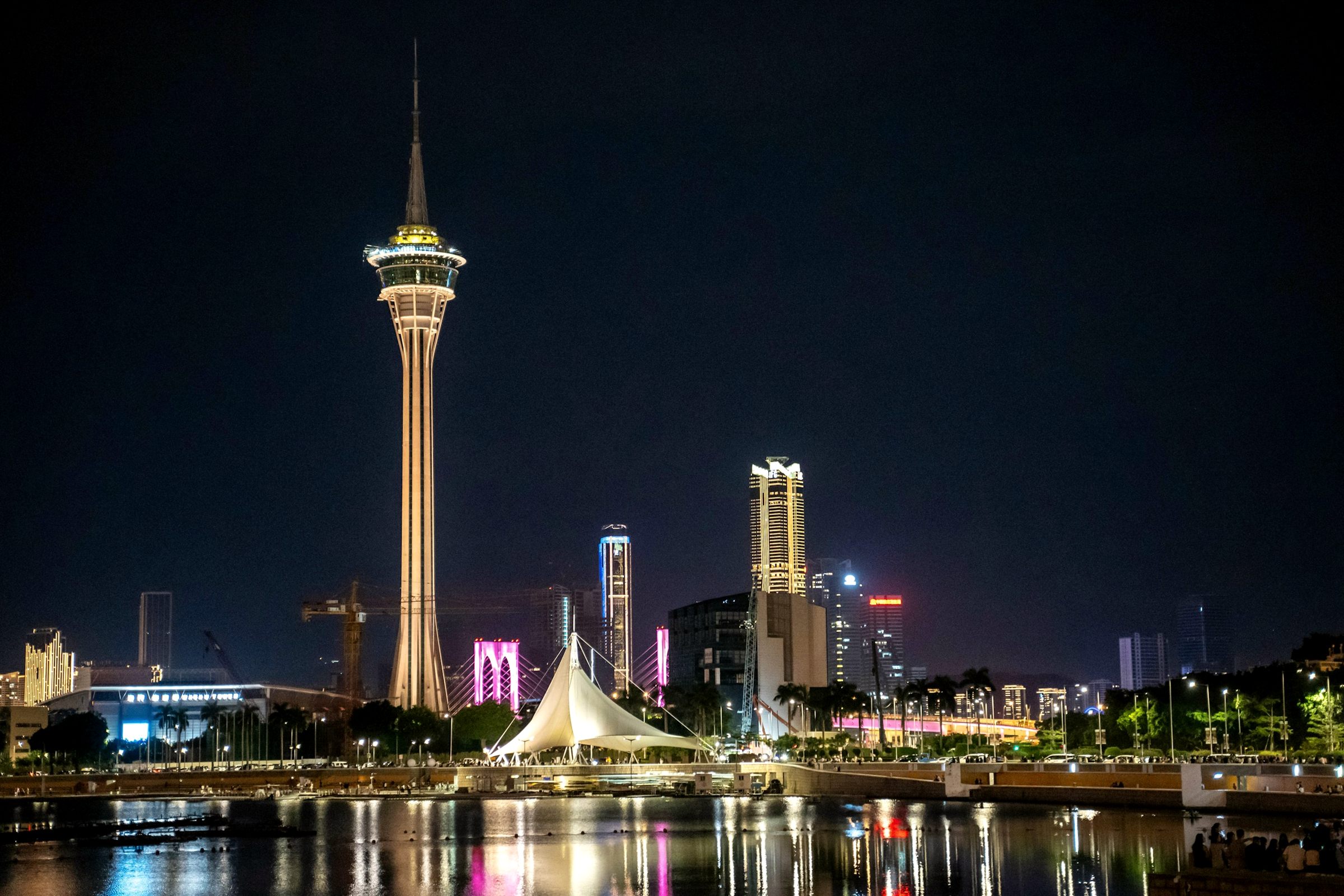 Macau Tower and skyline lit at night across the water