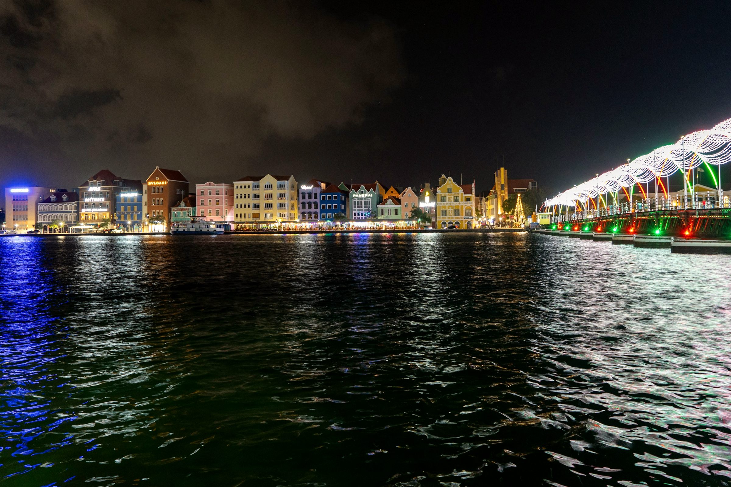Willemstad Handelskade and Queen Emma bridge lit at night