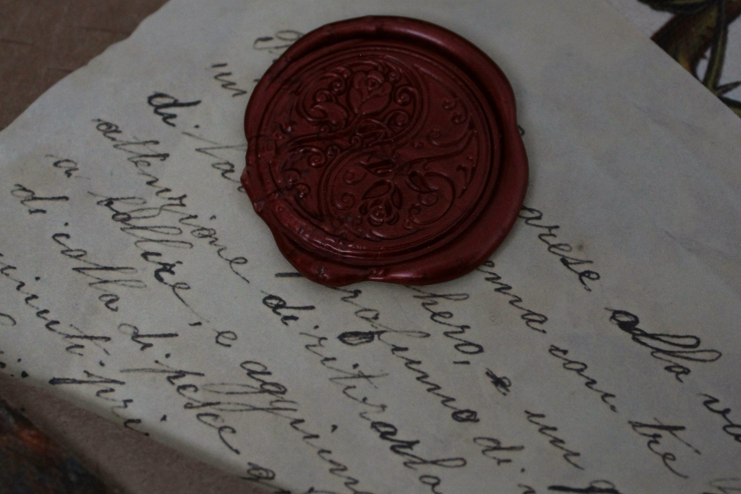 Red wax seal on an old handwritten document