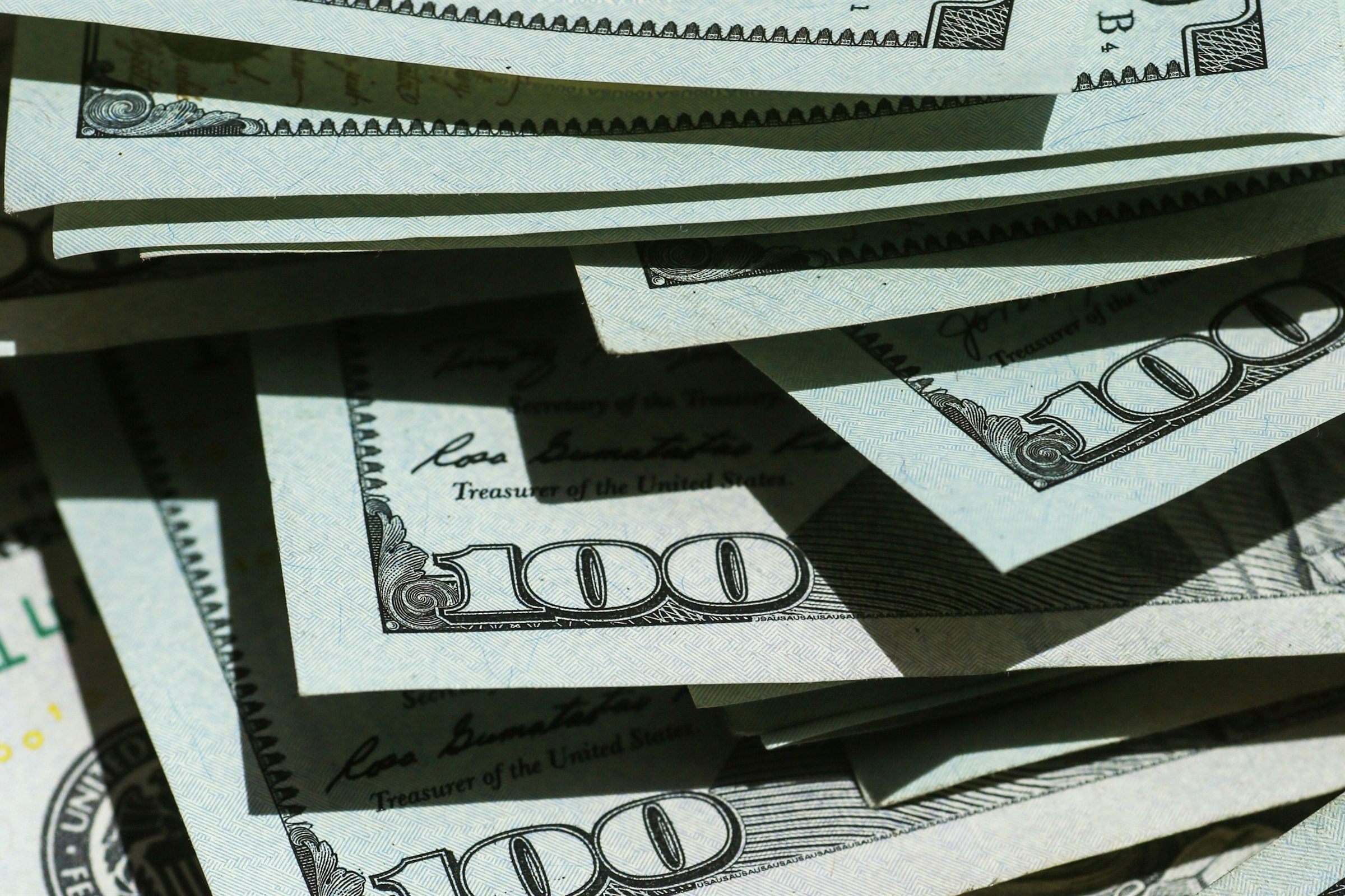 Close-up of fanned US hundred-dollar bills