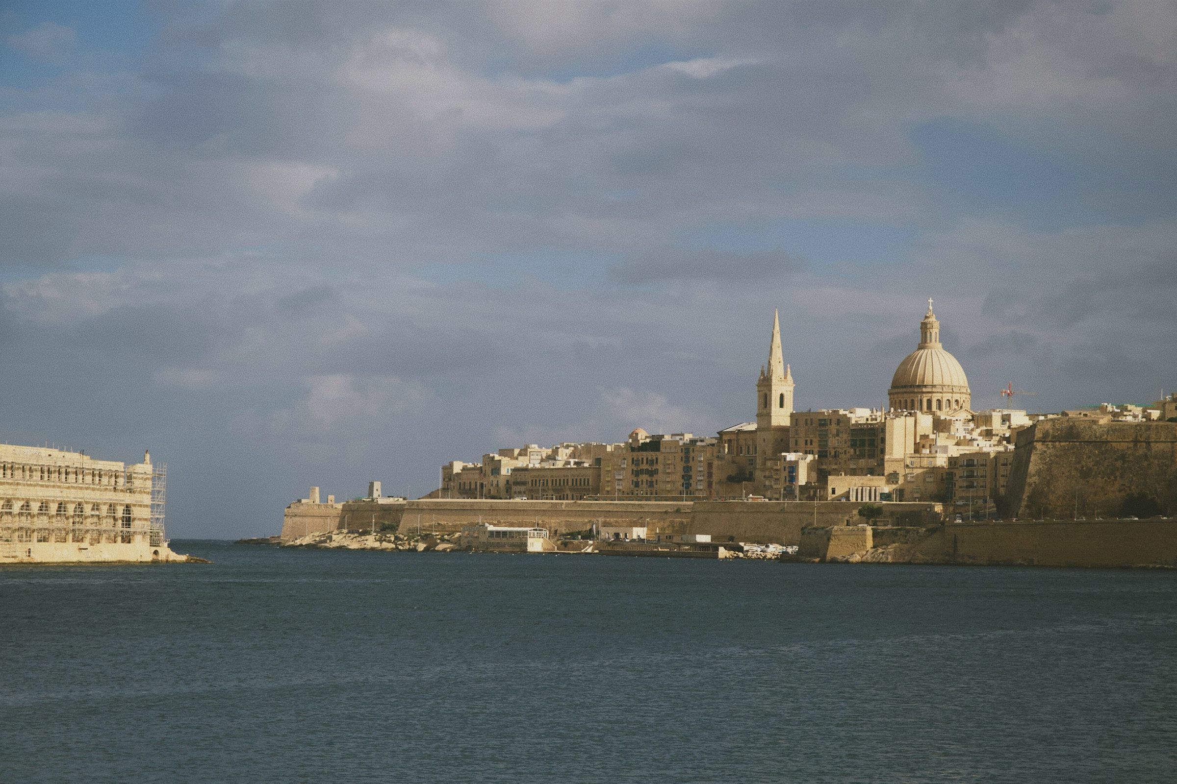 Valletta dome and fortifications across the harbour